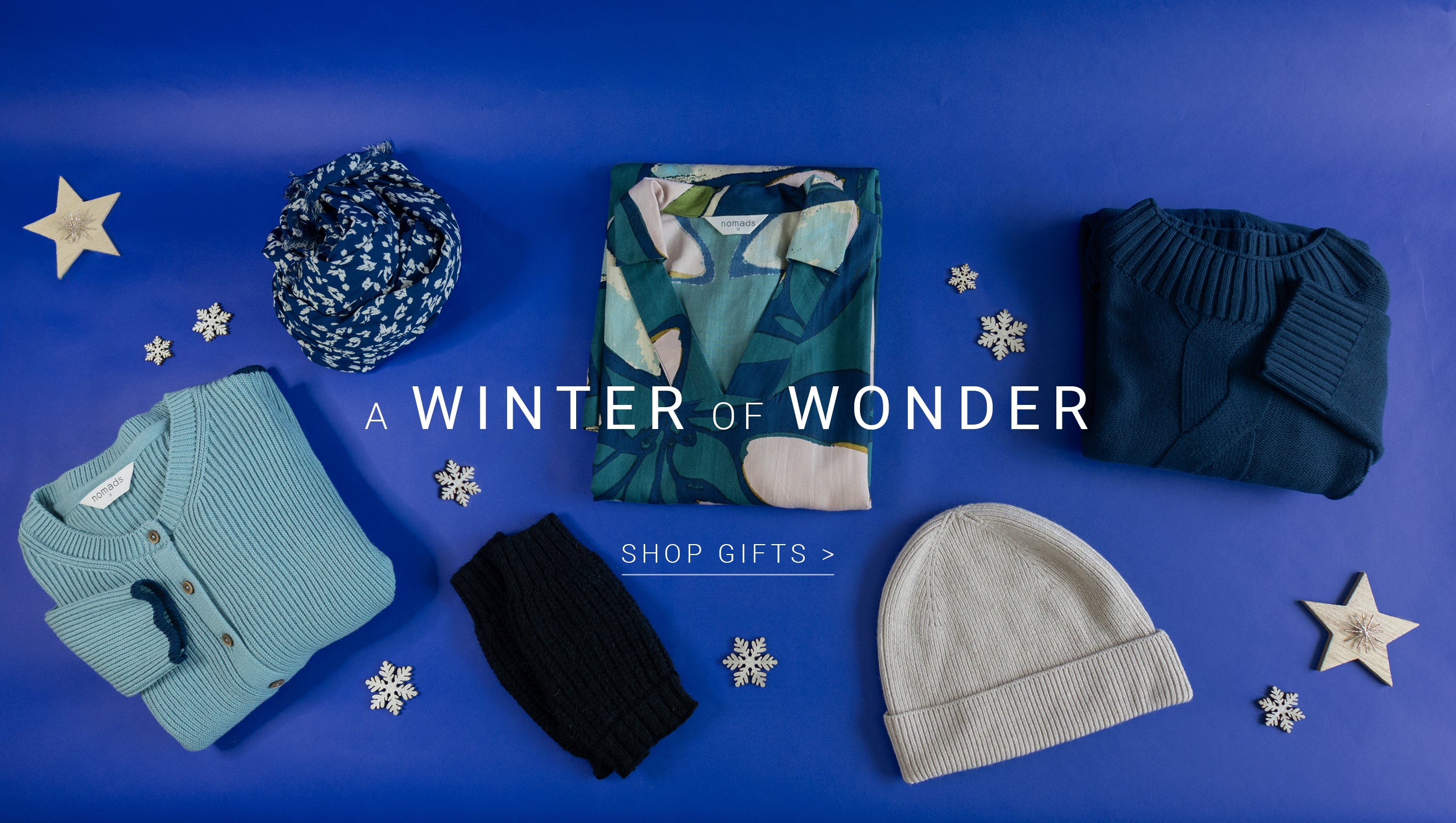 Winter clothing and accessories on a blue background with 'A Winter of Wonder' text.