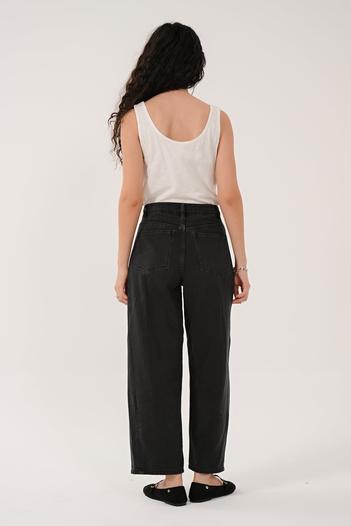 Back view of the black cotton barrel leg jeans