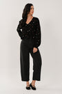 Black cotton barrel leg jeans styled for everyday wear