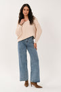 Full-length view of the blue wide leg denim jeans