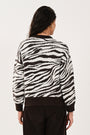 Back view showing the design of the women's chocolate jumper