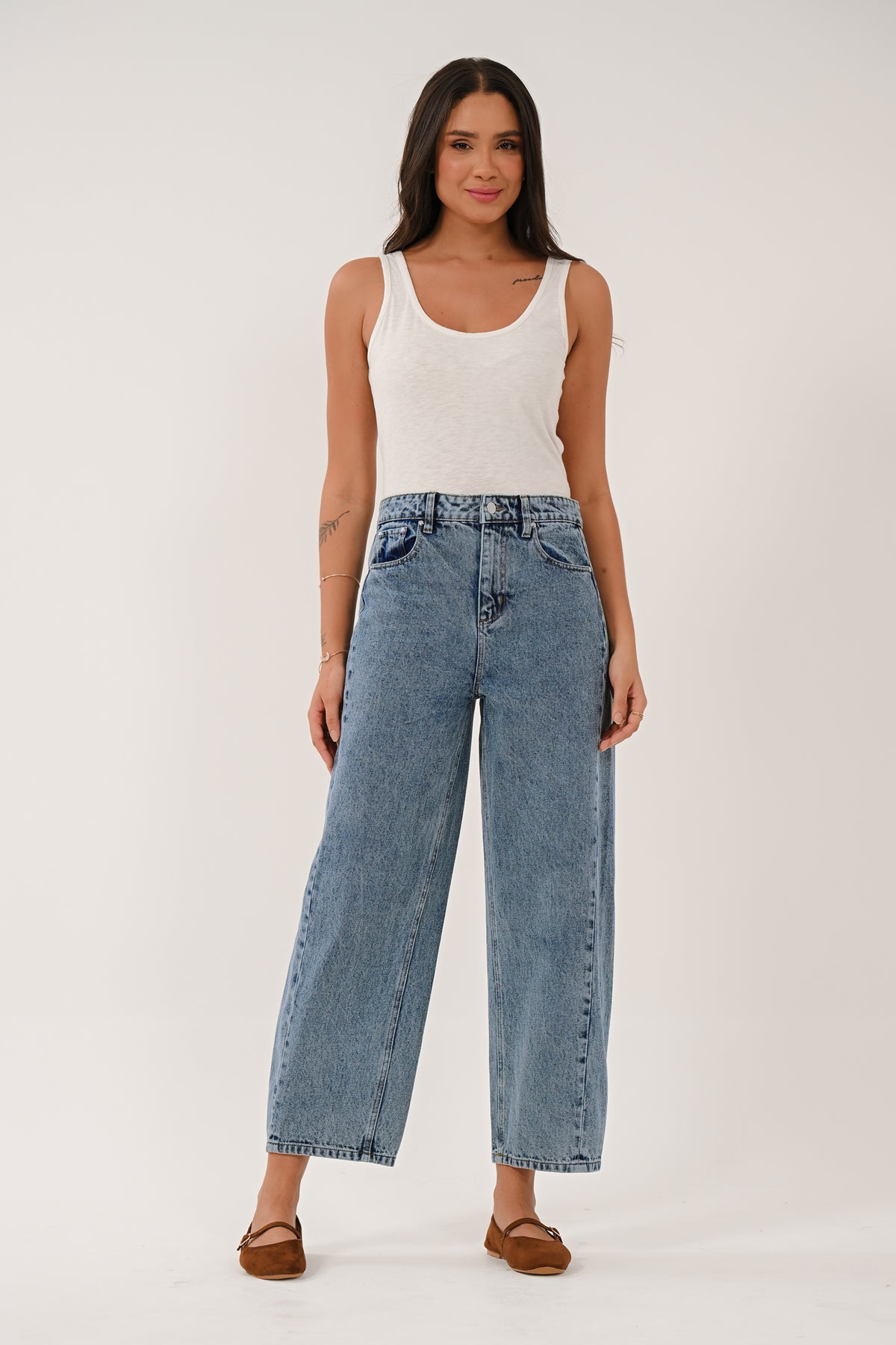 Blue barrel denim leg jeans styled for everyday wear