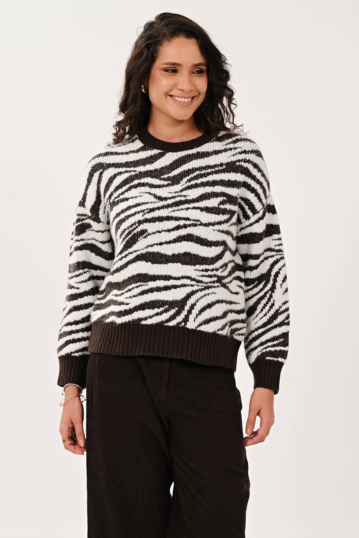 Women's chocolate crew neck jumper styled for a versatile seasonal outfit